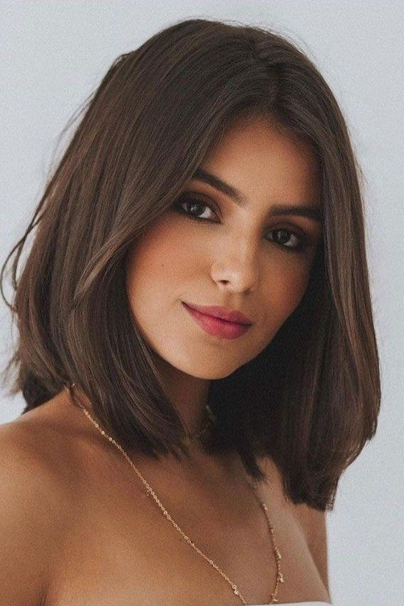 Classic Shoulder-Length Cut with Soft Layers and Center Part