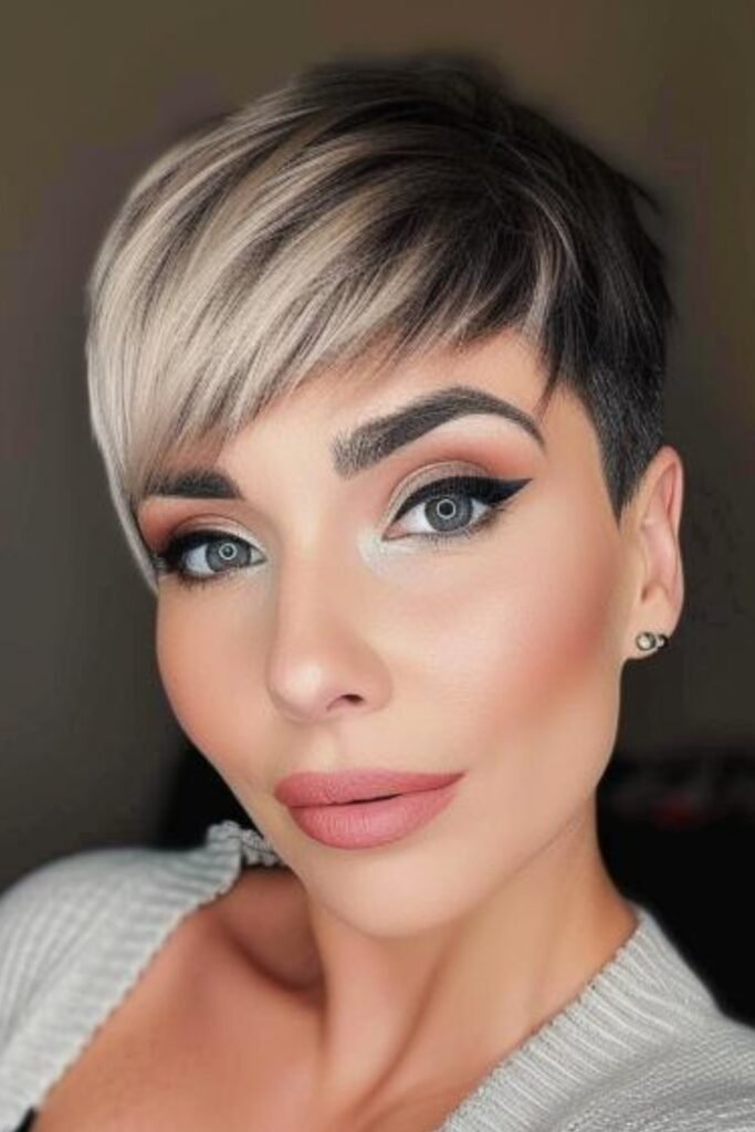 Edgy Pixie Cut with Deep Side-Swept Bangs and Undercut