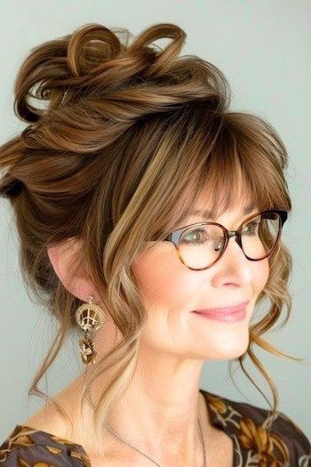 High Messy Bun with Curtain Bangs and Glasses