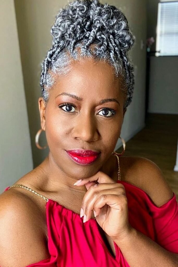 High Sculpted Twist Updo with Defined Curls