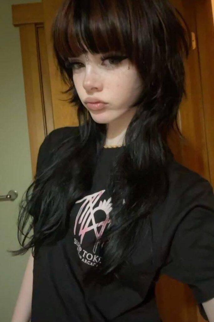 Long Shag Cut with Heavy Brow-Skimming Bangs