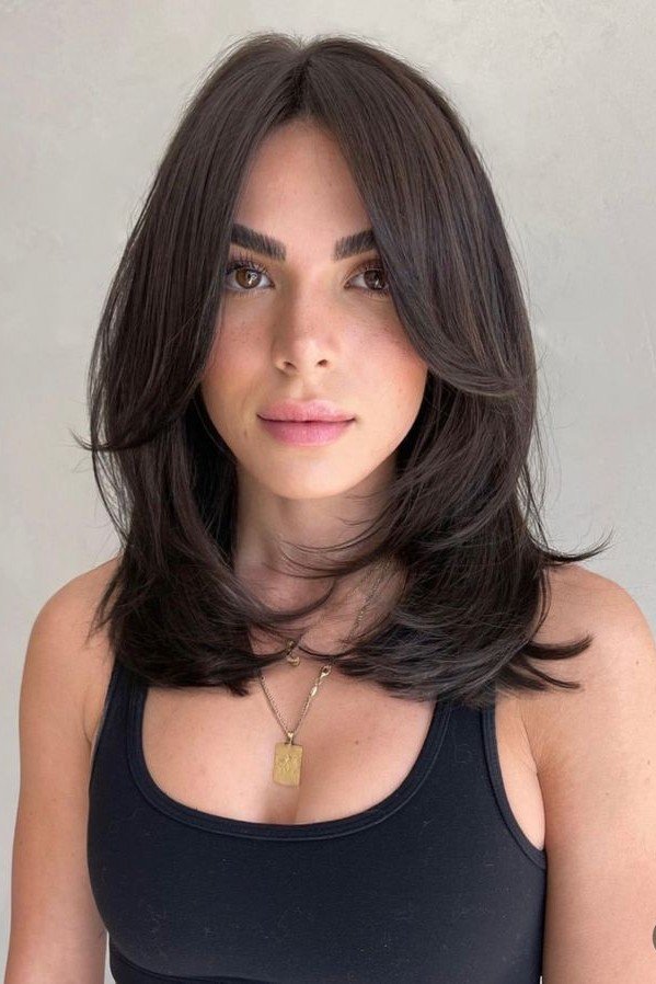 Mid-Length Layered Hair with Curtain Bangs