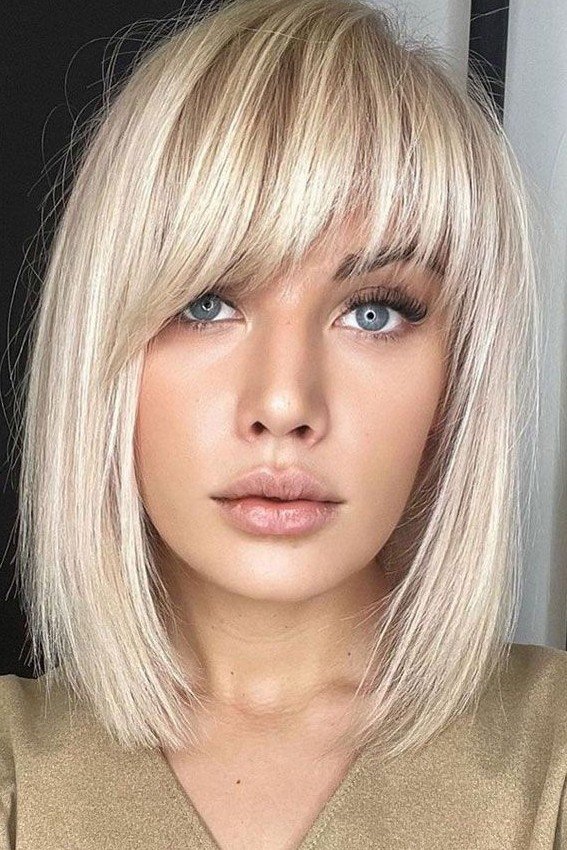 Sleek Blonde Bob with Side-Swept Bangs