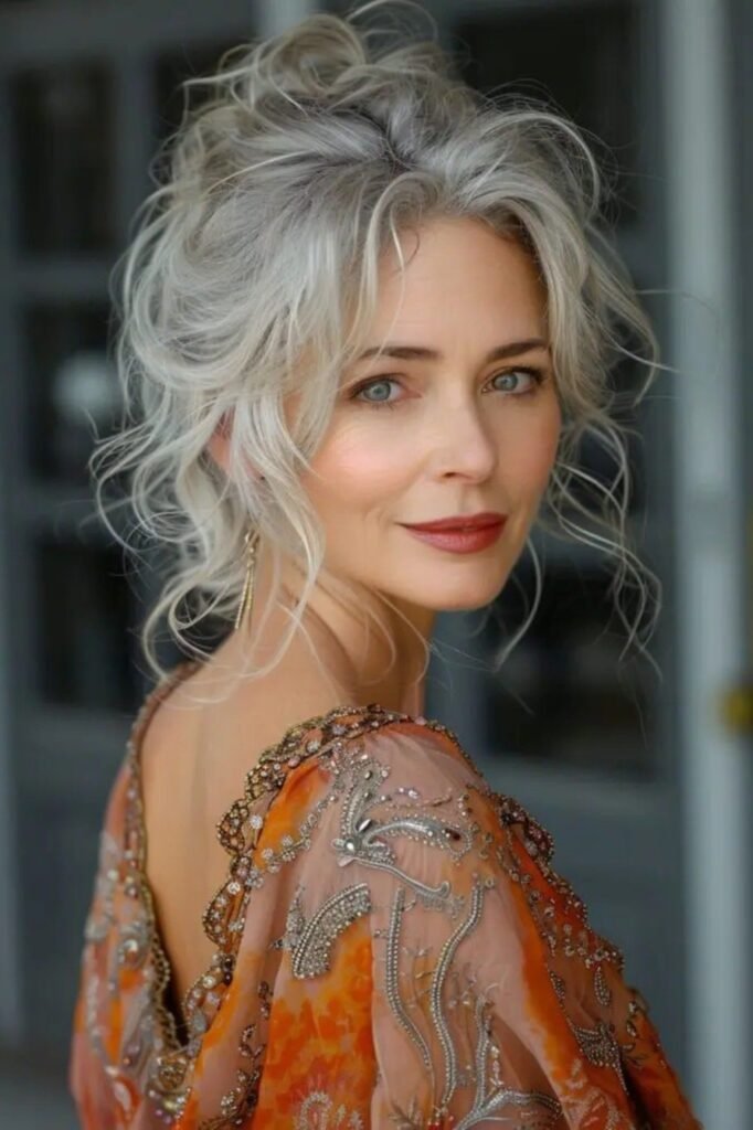 Textured Low Updo with Soft Face-Framing Tendrils