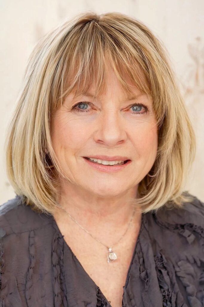 Voluminous Blonde Bob with Layered Bangs