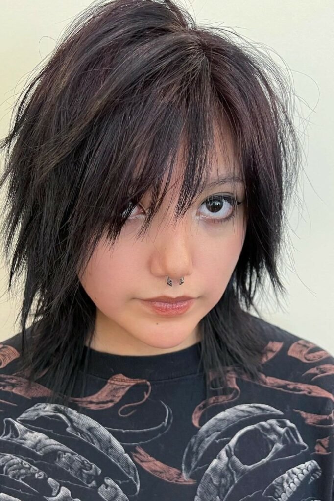 Voluminous Shaggy Cut with Heavy Side-Swept Bangs