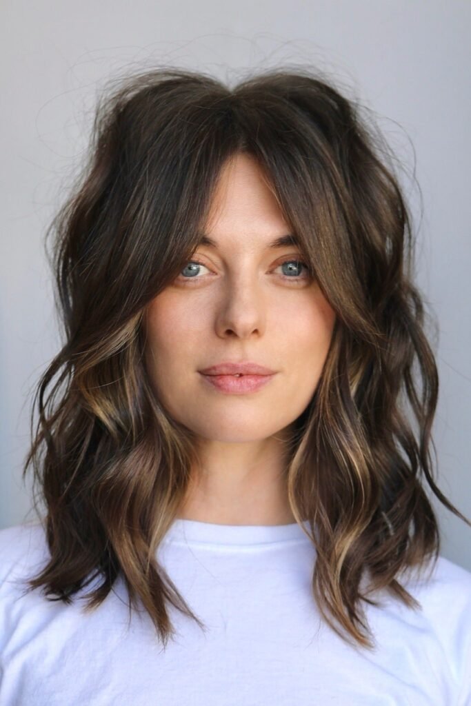 Wavy Medium-Length Hair with Curtain Bangs