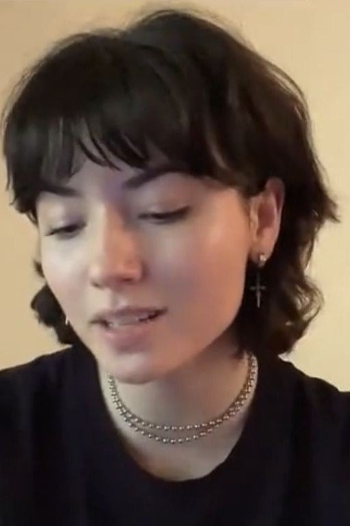 14. Short Textured Dark Shag with Bangs