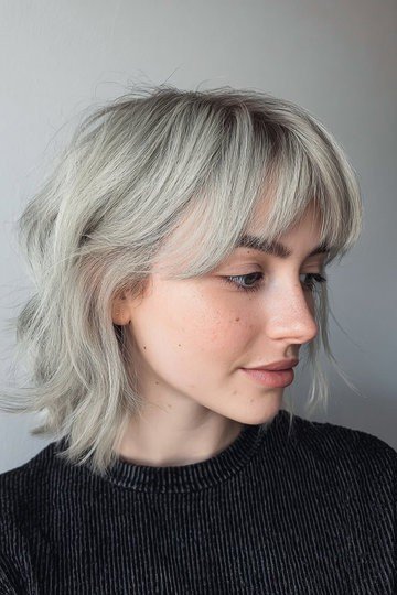 Ash Blonde Shaggy Bob with Soft Side-Swept Bangs