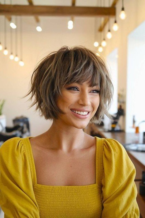 Ash Brown Layered Bob with Highlights and Wispy Bangs
