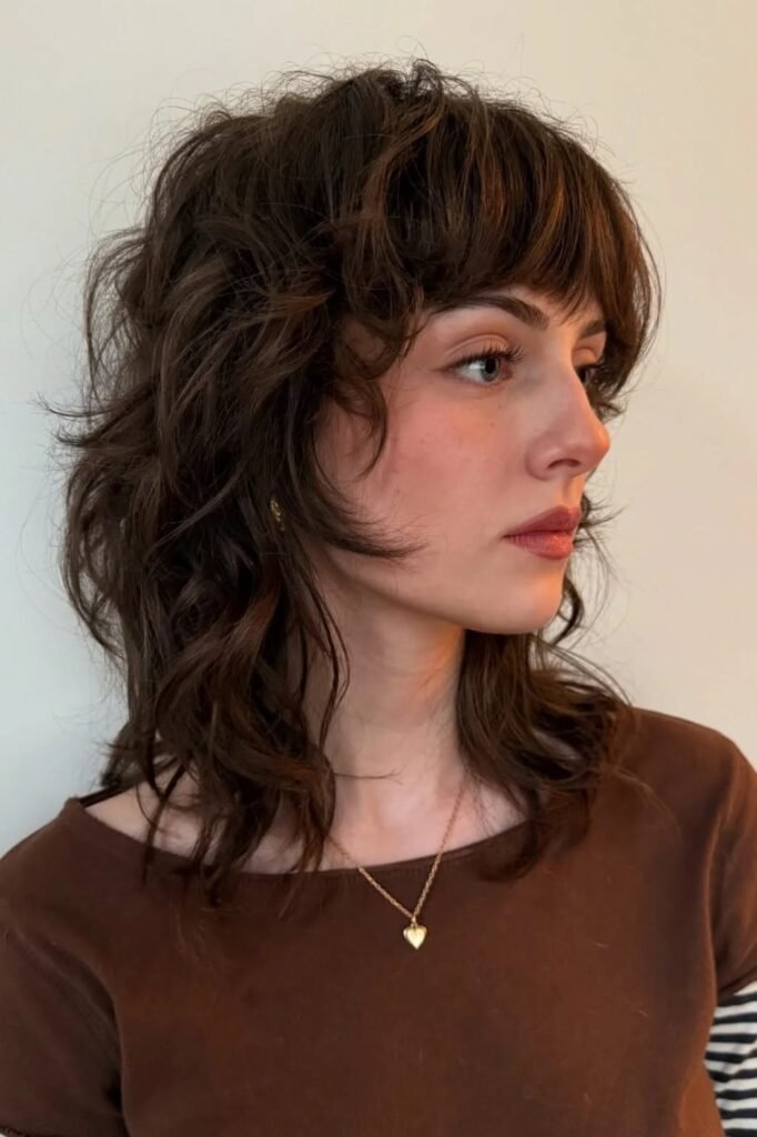 Brown Shaggy Haircut with Face-Framing Waves