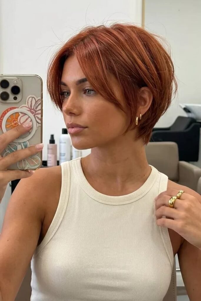 Copper-Toned Bob with Face-Framing Curtain Bangs