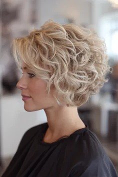 Curly Blonde Stacked Bob with Voluminous Layers
