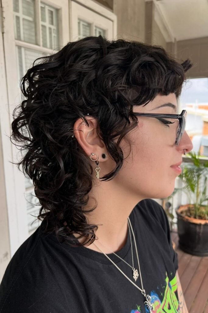 Dark Curly Shag with Side-Swept Bangs