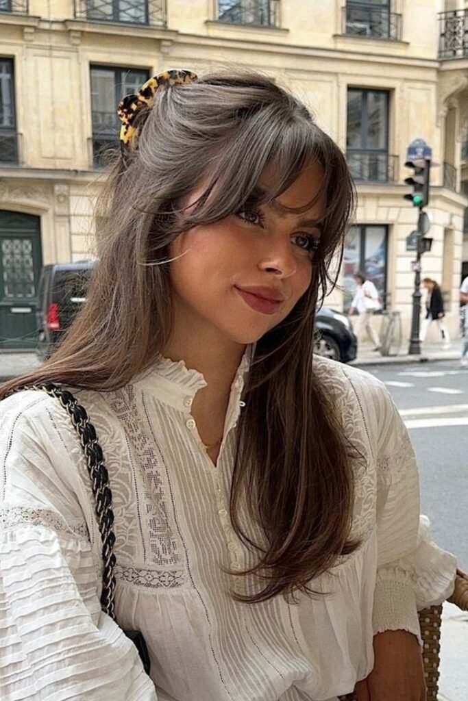 Half-Up Claw Clip Style with Curtain Bangs