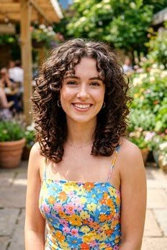 Layered Curly Cut with Soft Bangs