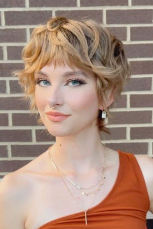 Layered Honey Blonde Shag with Soft Bangs