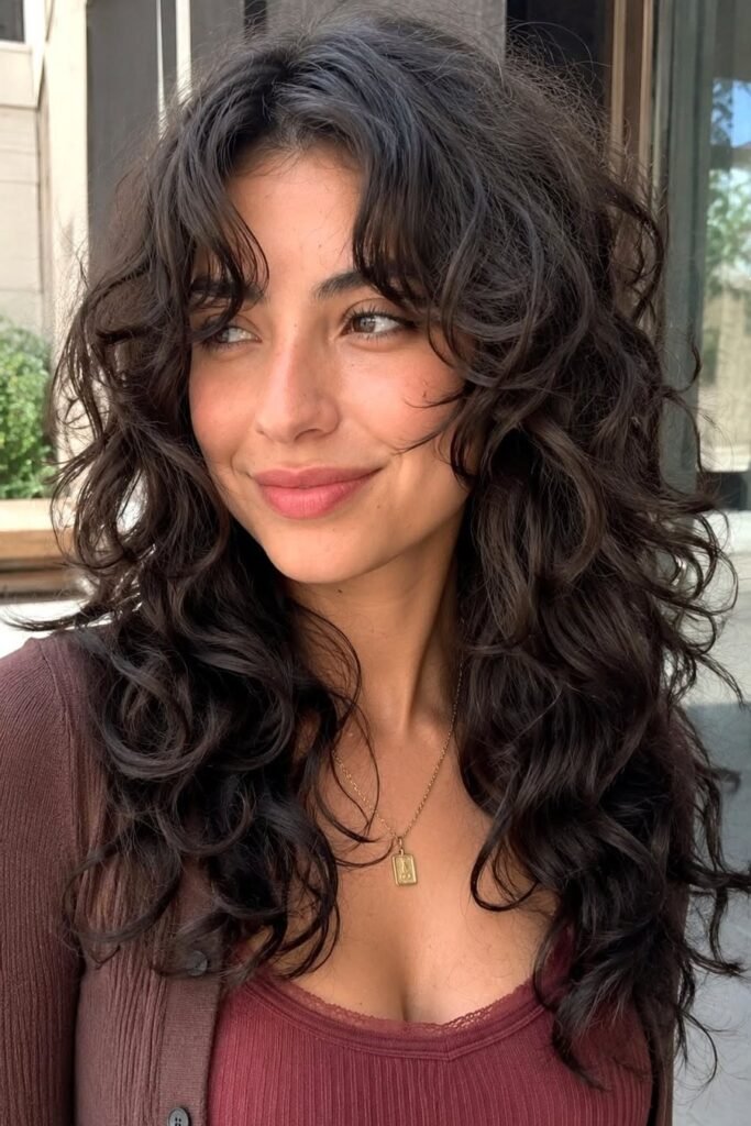 Long Layered Curly Hair with Soft Fringe
