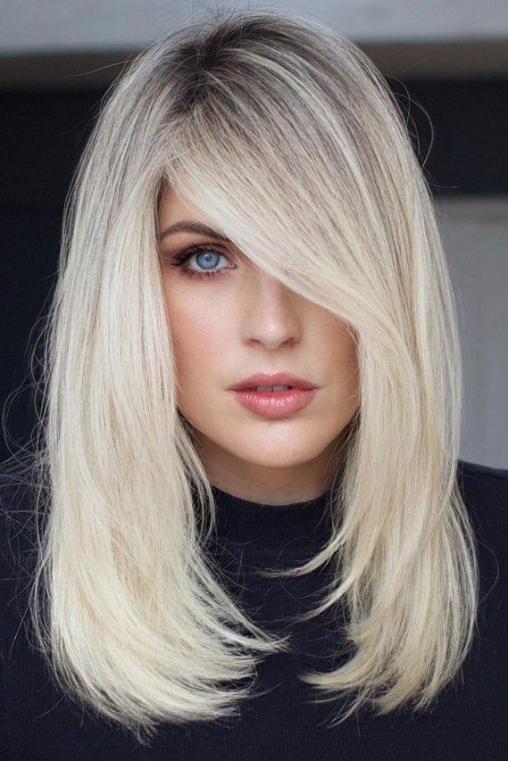 Long Layered Platinum Blonde Hair with Deep Side Part