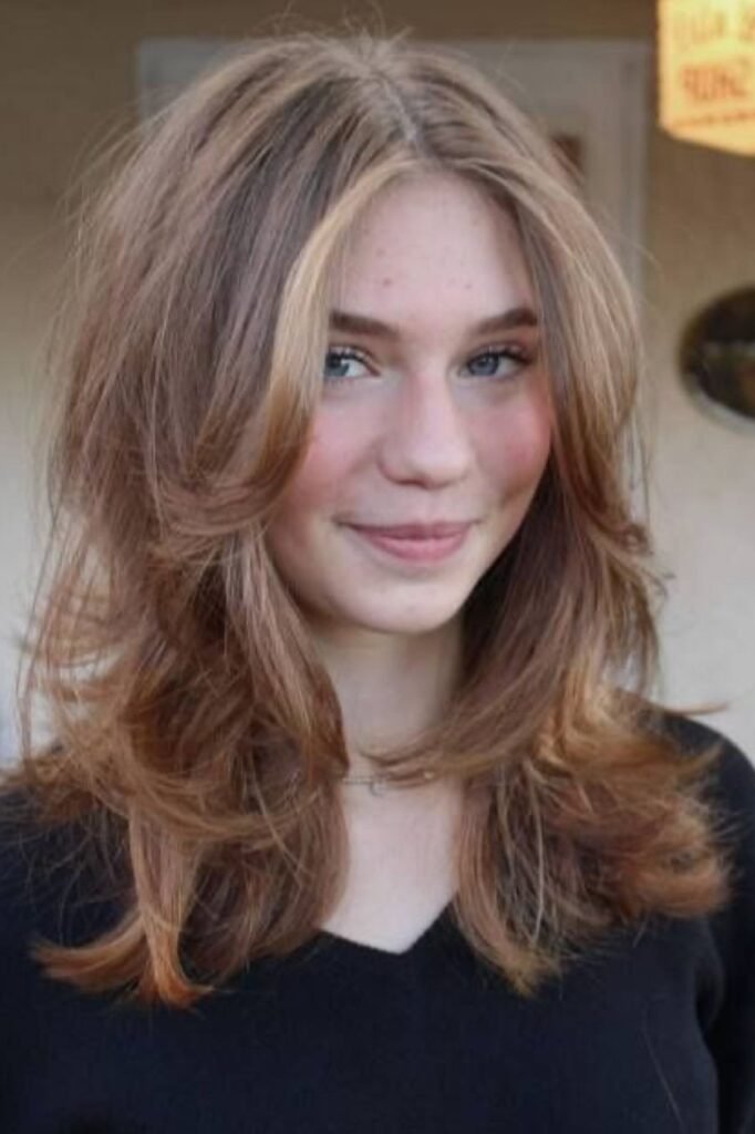 Medium Layered Haircut with Curtain Bangs