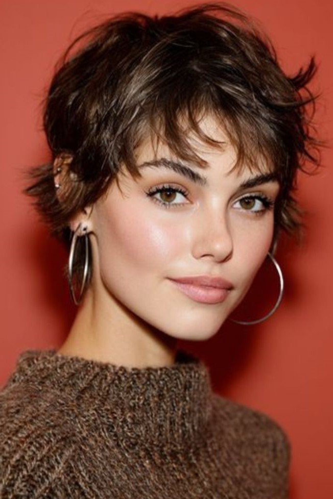 Messy Layered Pixie Cut with Hoops and Side-Swept Bangs
