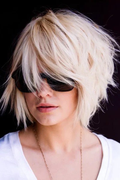 Messy Textured Platinum Bob with Side-Swept Bangs