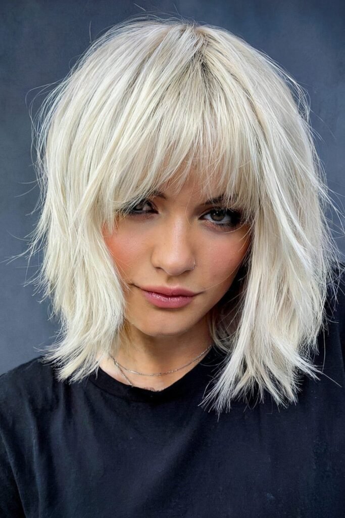 Platinum Blonde Choppy Bob with Layered Bangs