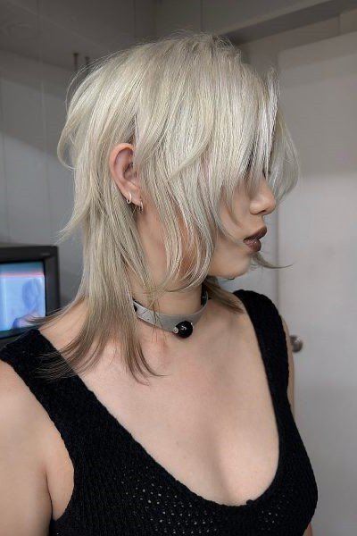 Platinum Blonde Layered Shag Haircut with Face-Framing Pieces