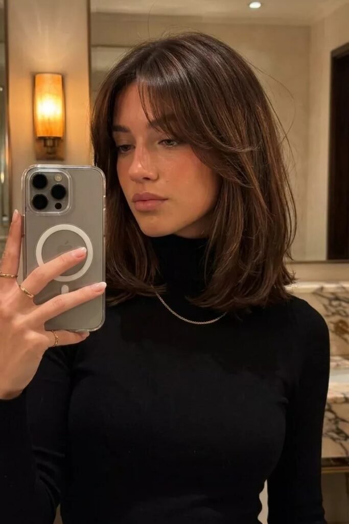 Polished Shoulder-Length Cut with Curtain Bangs