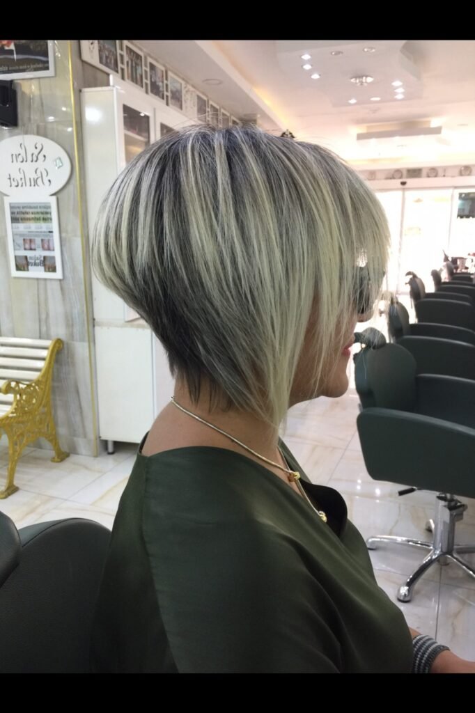 Rooted Blonde Sleek Asymmetrical Bob