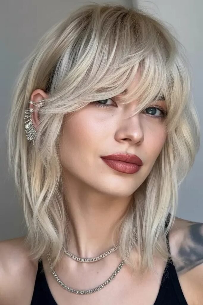 Shaggy Layered Bob with Dramatic Side-Swept Bangs