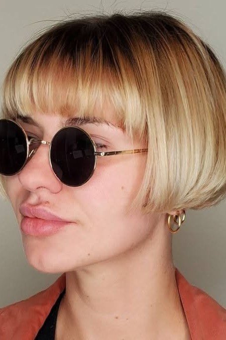 Sleek Bob with Straight Bangs and Ombre Blonde Tones