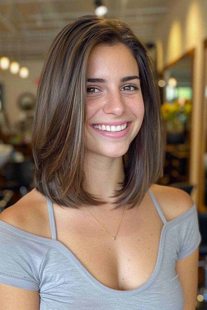 Sleek Layered Lob with Face-Framing Highlights