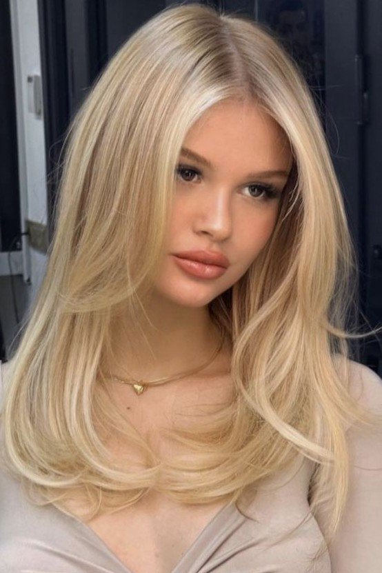 Soft Layered Blonde Hair with Curtain Bangs