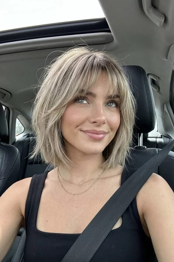 Textured Ash Blonde Bob with Curtain Bangs