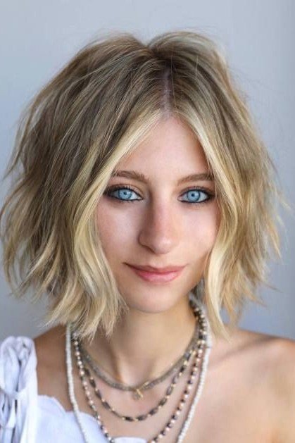 Textured Blonde Bob with Face-Framing Highlights