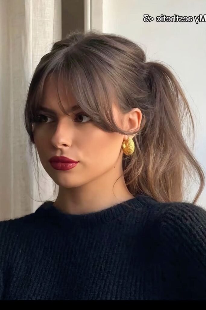 Textured High Ponytail with Loose Face-Framing Pieces