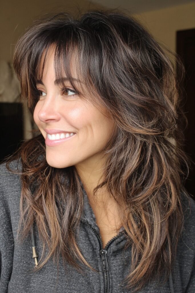 Textured Shag Haircut with Side-Swept Bangs and Highlights