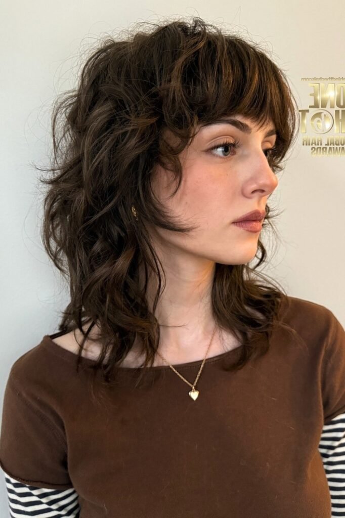 Textured Shag Haircut with Wavy Layers and Bangs