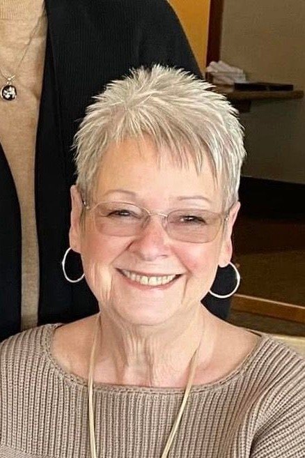 Textured Silver Spiky Pixie Cut with Side-Swept Bangs