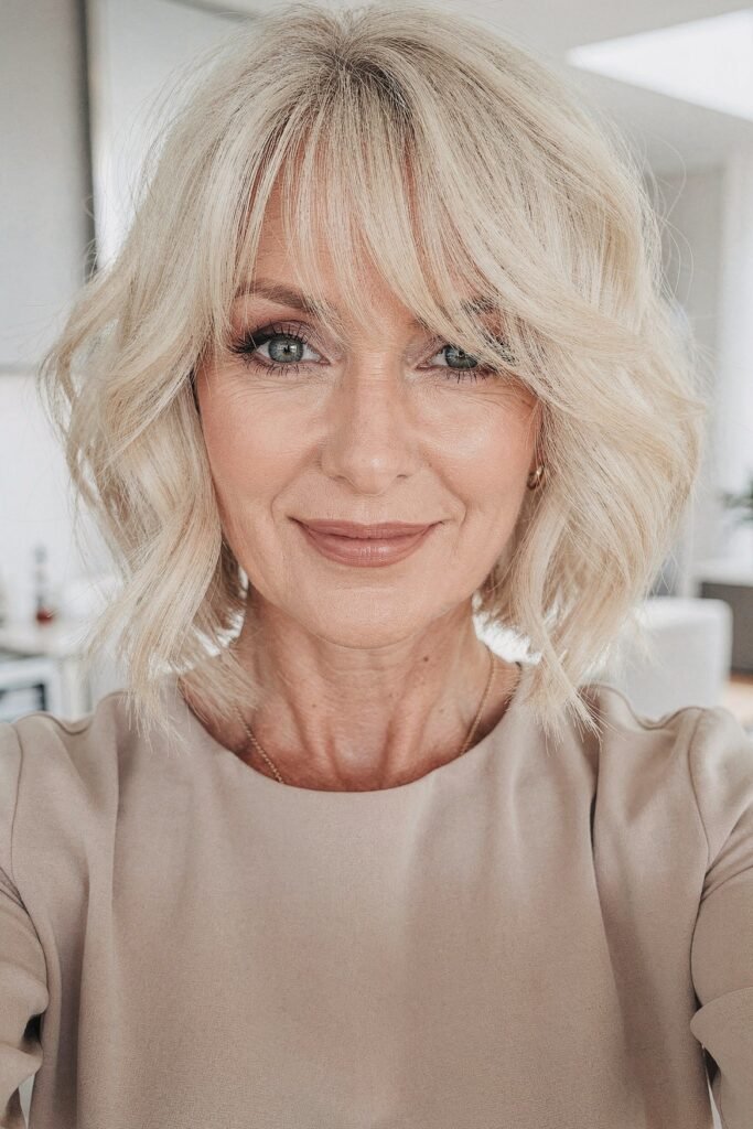Tousled Blonde Bob with Side-Swept Bangs