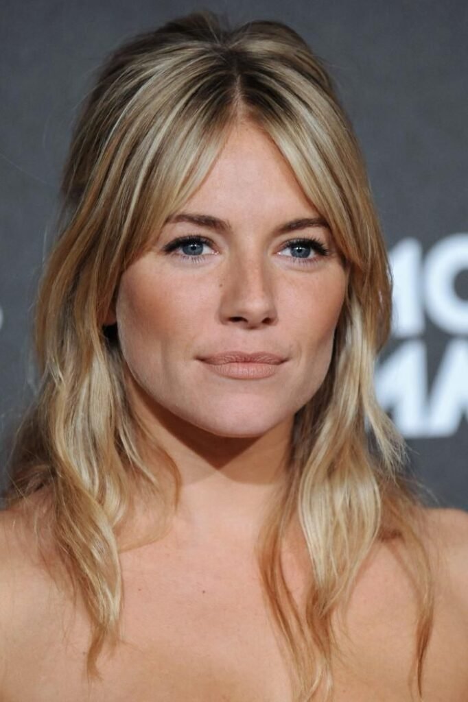 Tousled Blonde Half-Up Style with Long Curtain Bangs