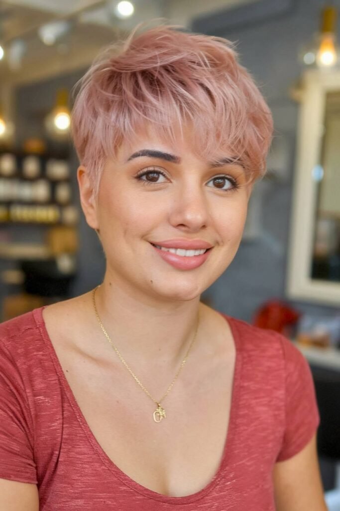 Tousled Pink Pixie Cut with Side-Swept Bangs