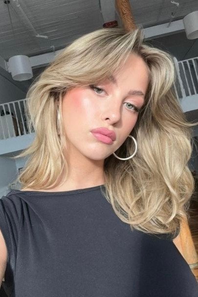 Voluminous Layered Waves with Side-Swept Bangs