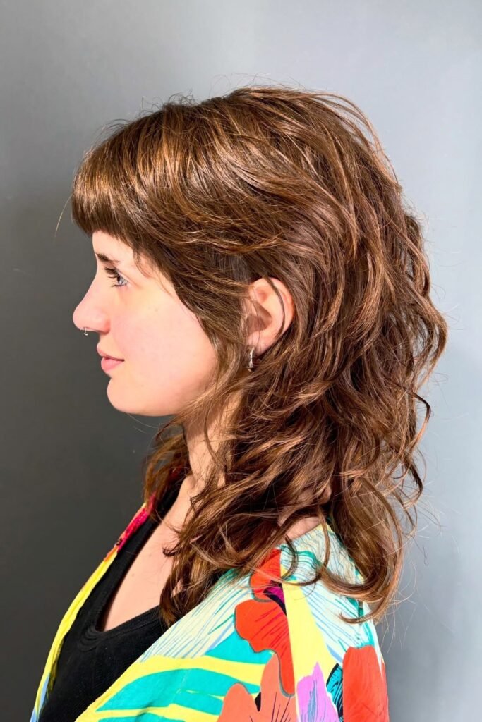 Warm Brown Shaggy Mullet with Soft Layers and Bangs