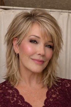 Blonde Layered Shag with Side-Swept Bangs