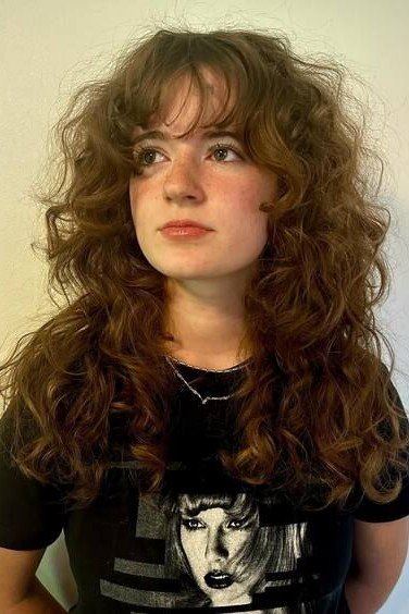 Brown Curly Shag with Eyebrow-Grazing Bangs