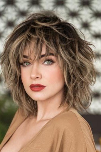 Choppy Layered Bob with Soft Bangs and Honey Highlights