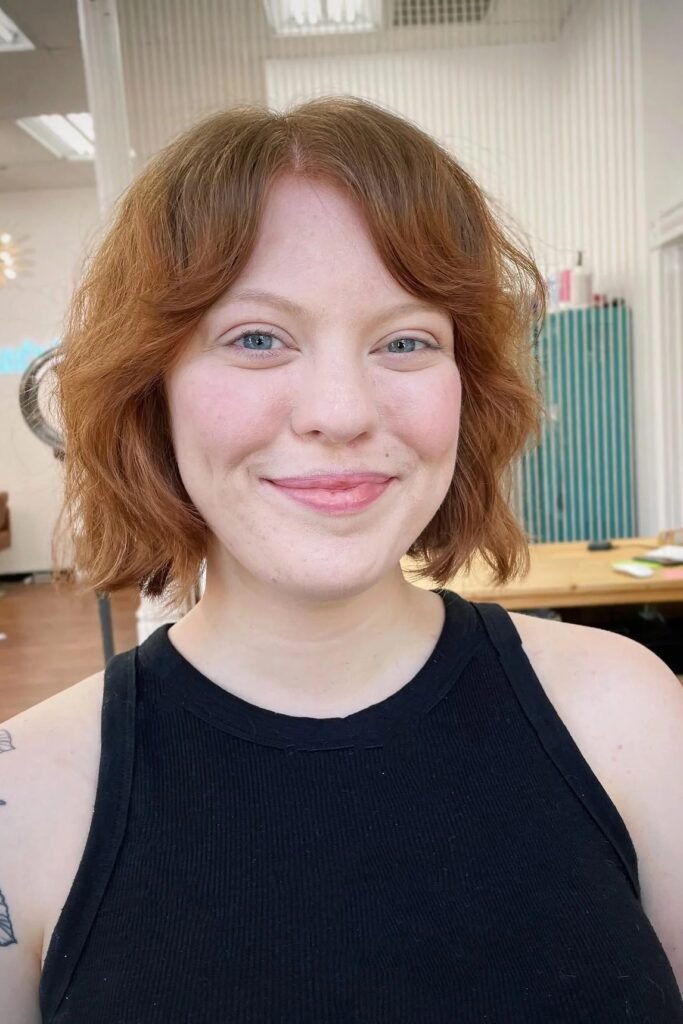Choppy Red Bob with Soft Curtain Bangs
