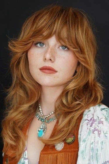 Copper-Toned Shag Haircut with Face-Framing Layers and Bangs